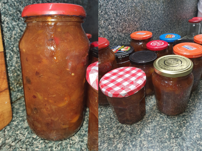 A jar full of chutney, and a bunch of chutney jars with lids